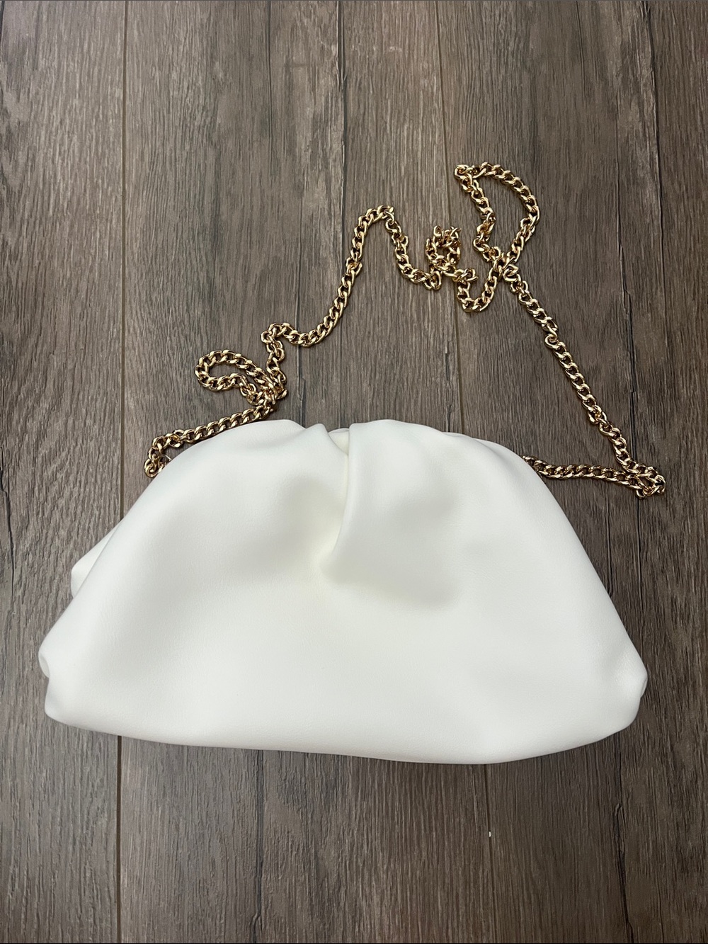 Understated Leather White Dumpling Shoulder Bag with Gold Chain